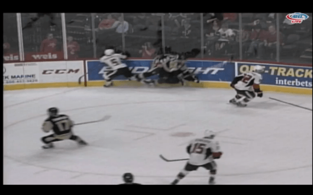 Referee Geoff Miller is crashed into in the corner...