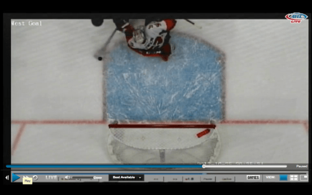 Here is Thompson shooting the puck into the net...
